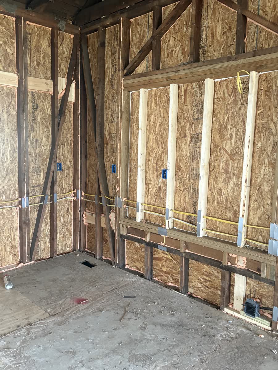 Summit Building more unfished interior with wires running